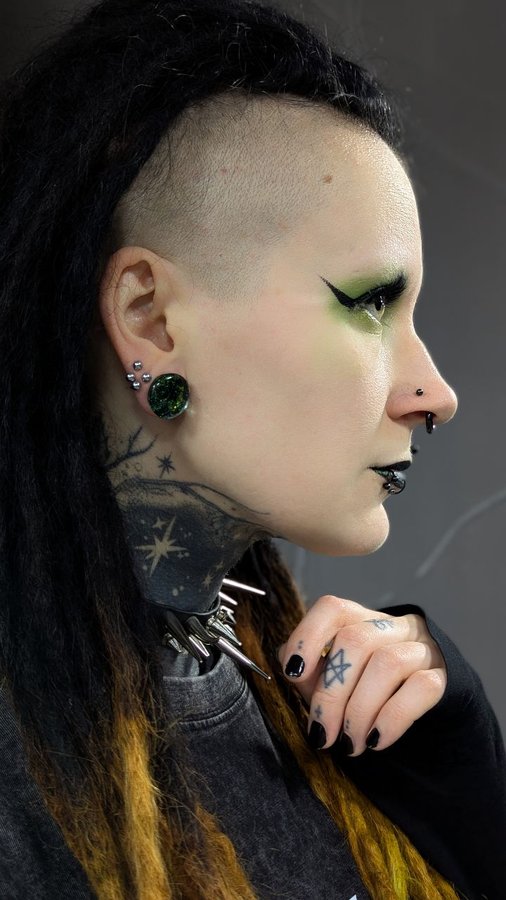 Instagram post by @eerie_elli for Custom Plugs. Caption reads: Check out @ukcustomplugs ✨ #ad #stretchedears....