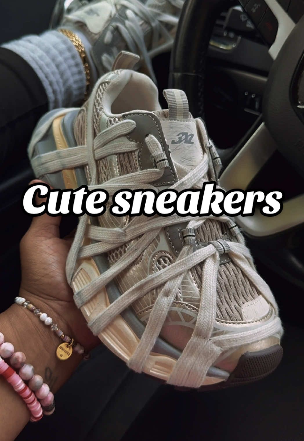 TikTok post by @kenyattamademebuyit for ShopAKIRA. Caption reads: @AKIRA  is Everything 🤍🤍🤍. These sneakers 🔥🔥.....