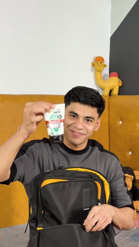 Instagram post by @ungraduate_ayush for Garnier Men Indonesia. Caption reads: Every big event has one guarantee. A random pimple....