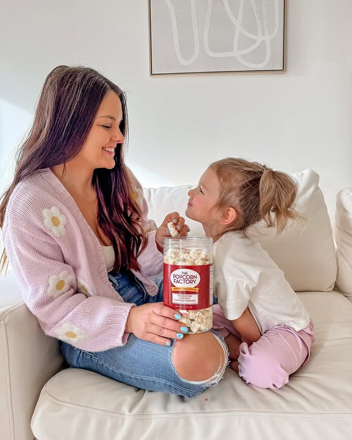 Instagram post by @k.neeekola for The Popcorn Factory. Caption reads: Happy National Popcorn Day! 🎉 #ad Treat yourself....