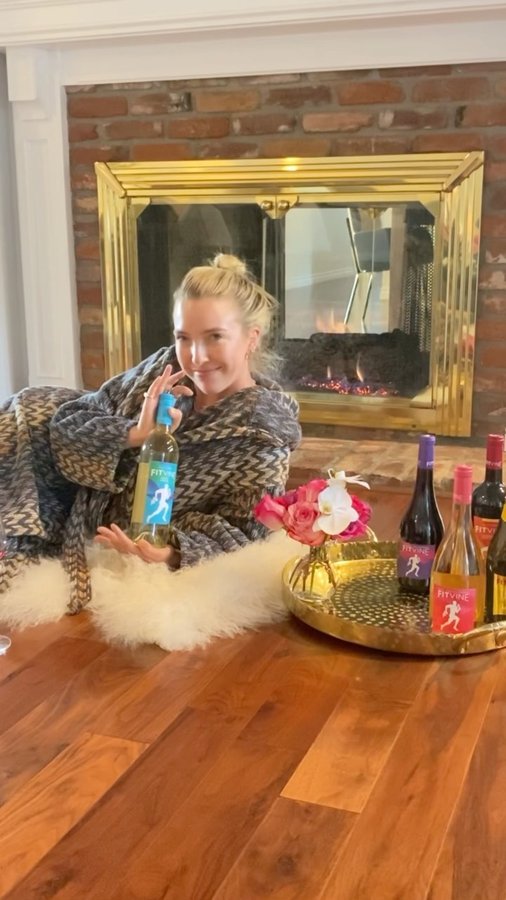 Instagram post by @jackieschimmel for Fitvine Wine. Caption reads: @fitvine_wine #liveyourfit #FitVinePartner #ad.