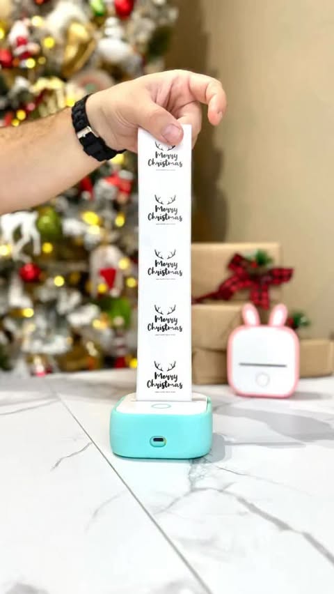 Instagram post by @erencmlbl for Phomemo. Caption reads: This tiny printer is officially my new obsession....