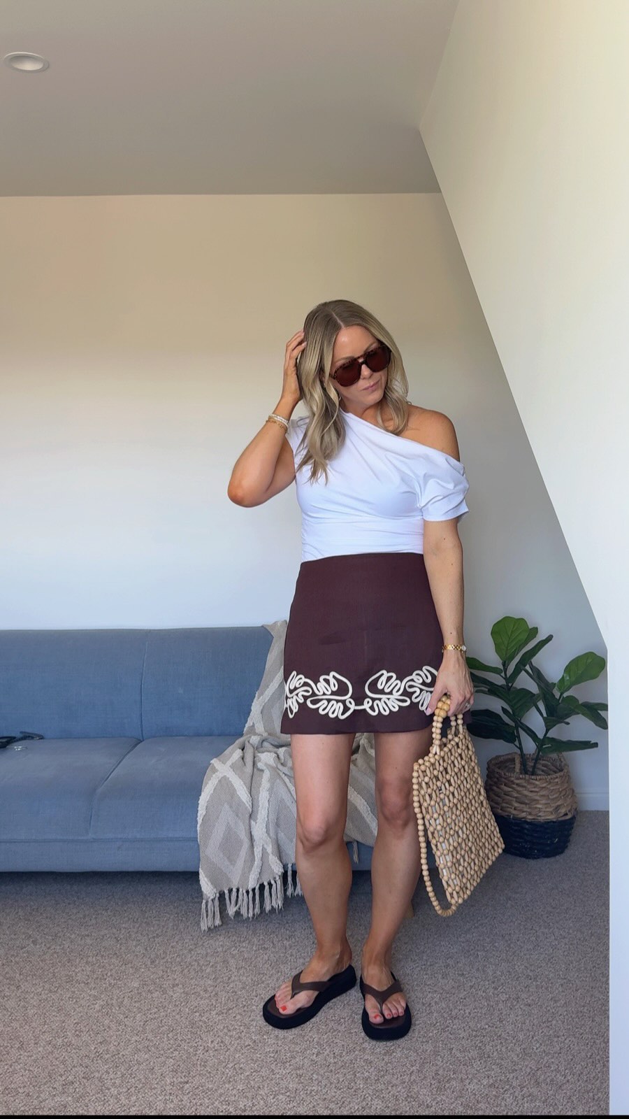 Instagram post by @therealhousewifeofnorwood for THE ICONIC. Caption reads: Summer outfits made easy thanks to @theiconicau.....