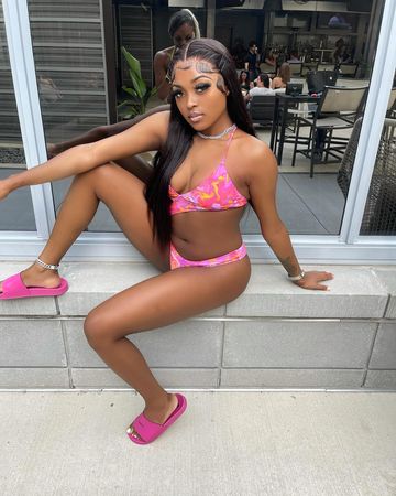 Instagram post by @dayladoll for Icon Swim. Caption reads: lookin EXOTIC 👅 !!
lashes: @pnkdluxe 
swimsuit:....