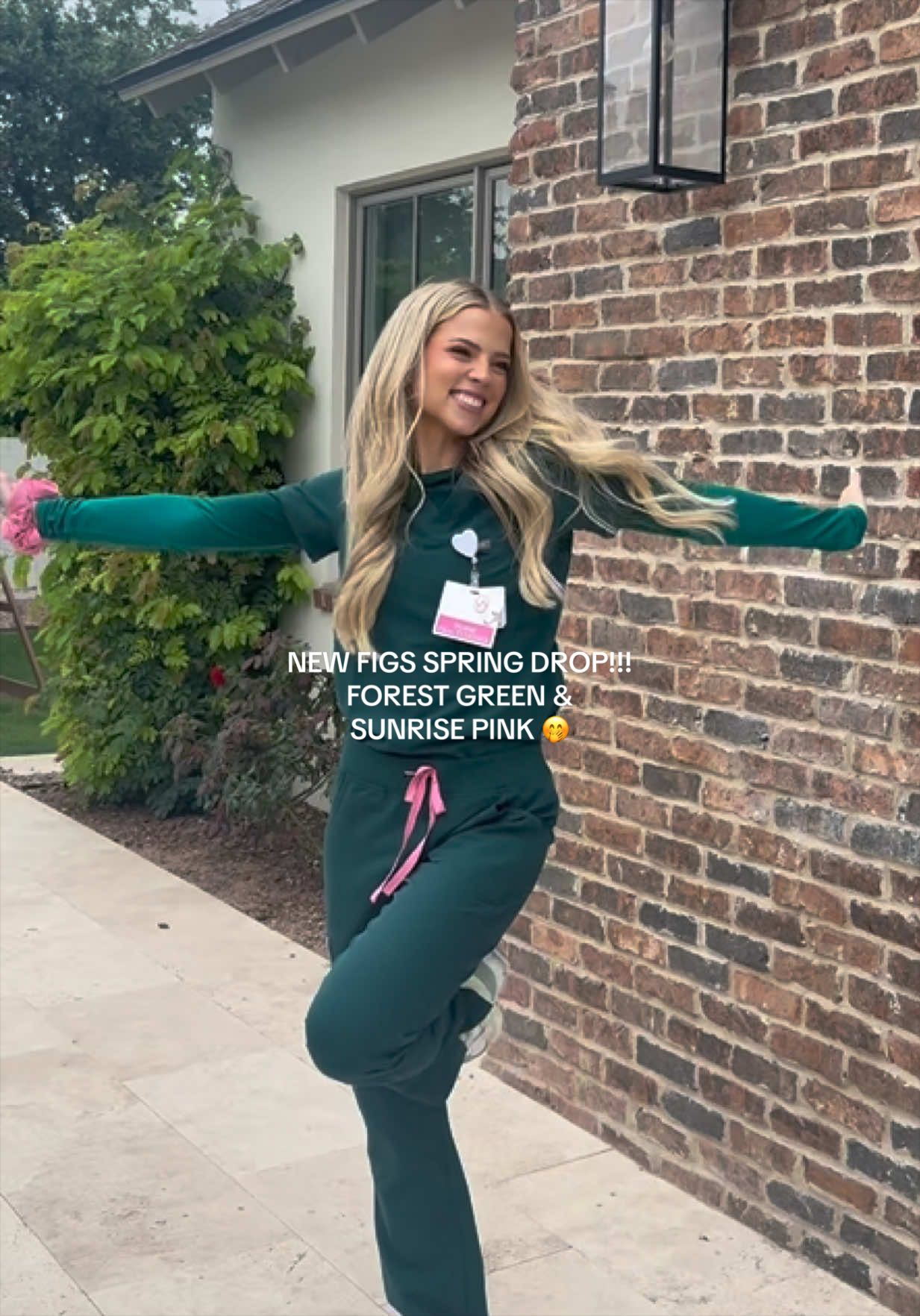 TikTok post by @darbyyyyb_ for FIGS. Caption reads: IT’S HERE!!! FIGS new spring drop, forest green &....