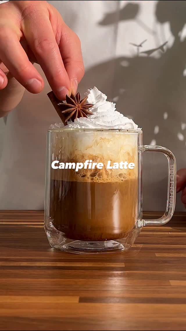 Instagram post by @yourcoffeedude for AeroPress. Caption reads: Campfire Latte w\ @aeropress 🏕️🔥 Recipe....