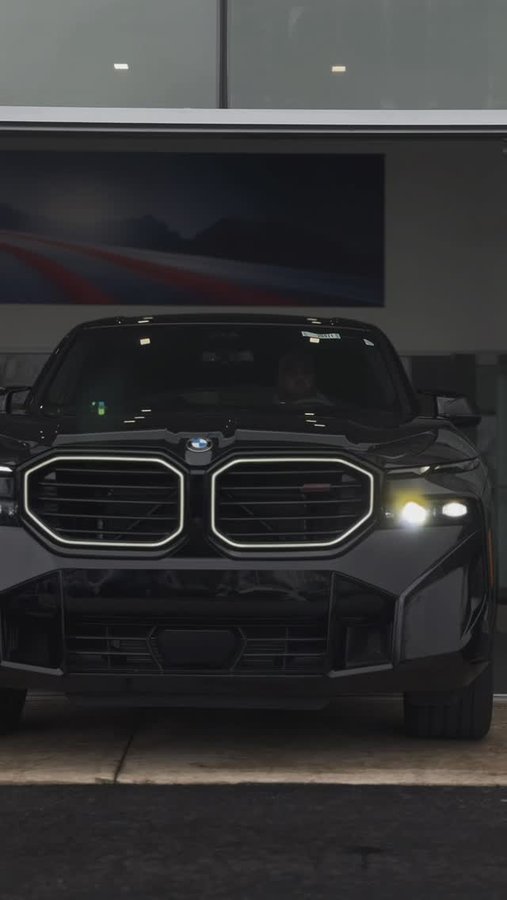 Instagram post by @jordantsanford for Cuts Clothing. Caption reads: The #BMW XM Label Red 🏁
Outfit: @cuts....