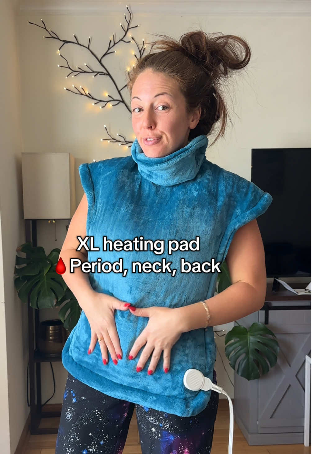 TikTok post by @jackieriso for RENPHO. Caption reads: The best heating pad you’ll find for neck, back or....