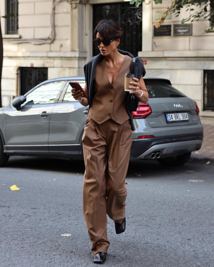 Instagram post by @nurbilenyavuzer for JIL SANDER. Caption reads: Forever a suit girl🎩

#reklam.