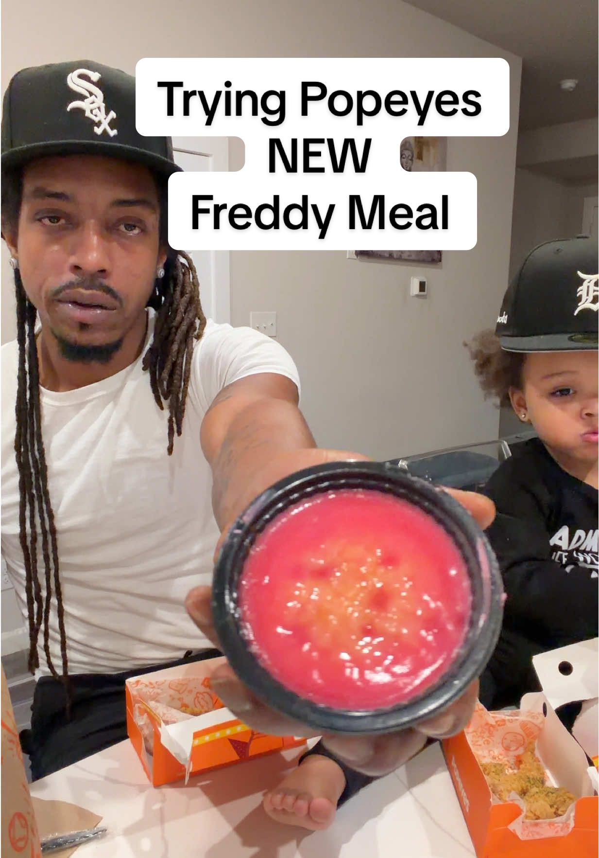 TikTok post by @greeskoandooda for Popeyes. Caption reads: Trying @Popeyes New Five Nights at Freddy meal it....