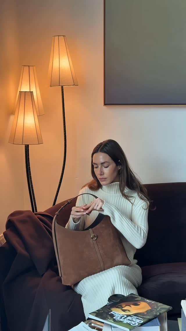 Instagram post by @jelena.nyc for Strathberry. Caption reads: morning coffee runs, but make it fall chic 🍂☕️....