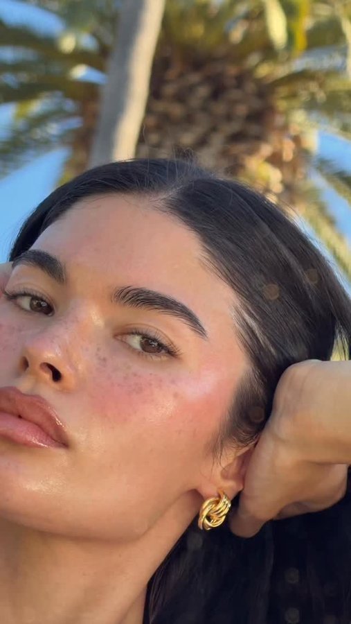 Instagram post by @aishapotter for Summer Fridays. Caption reads: @summerfridays holiday trio 🍬 ad.