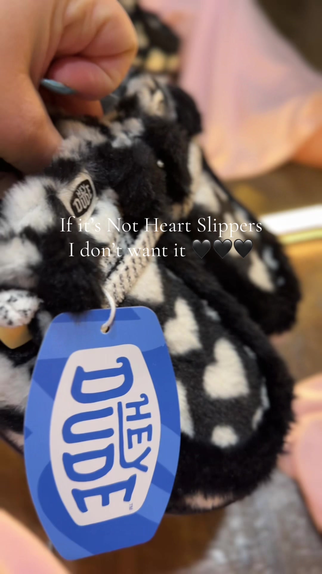 TikTok post by @whitneymendel for HEYDUDE shoes. Caption reads: New HeyDude Heart Slippers @HeyDude .