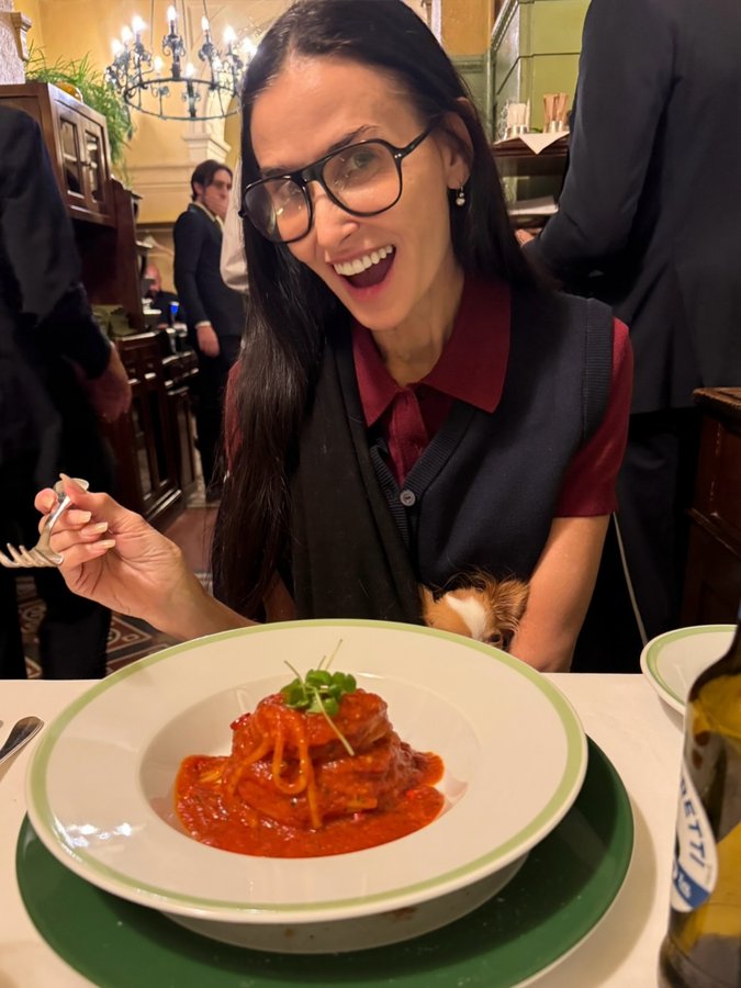 Instagram post by @demimoore for Wonderbelly. Caption reads: On-the-go essentials 🍝🐶✈️ @itswonderbelly....