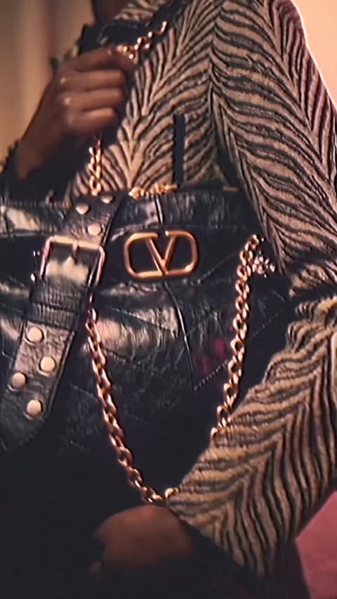 Instagram post by @neptunianglitterball for Valentino. Caption reads: [...] or be hunted.
Unleashing the....