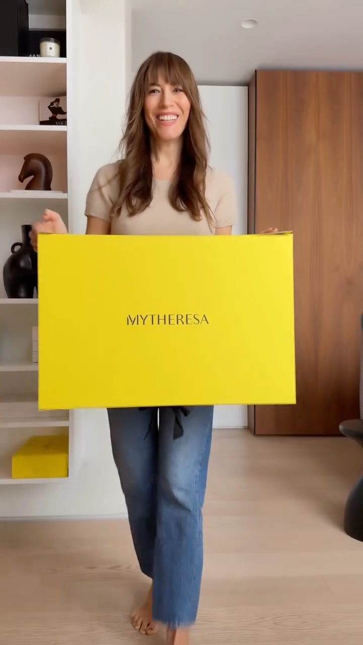 Instagram post by @inmystyle for Mytheresa. Caption reads: This yellow box always makes me feel better 💛New....