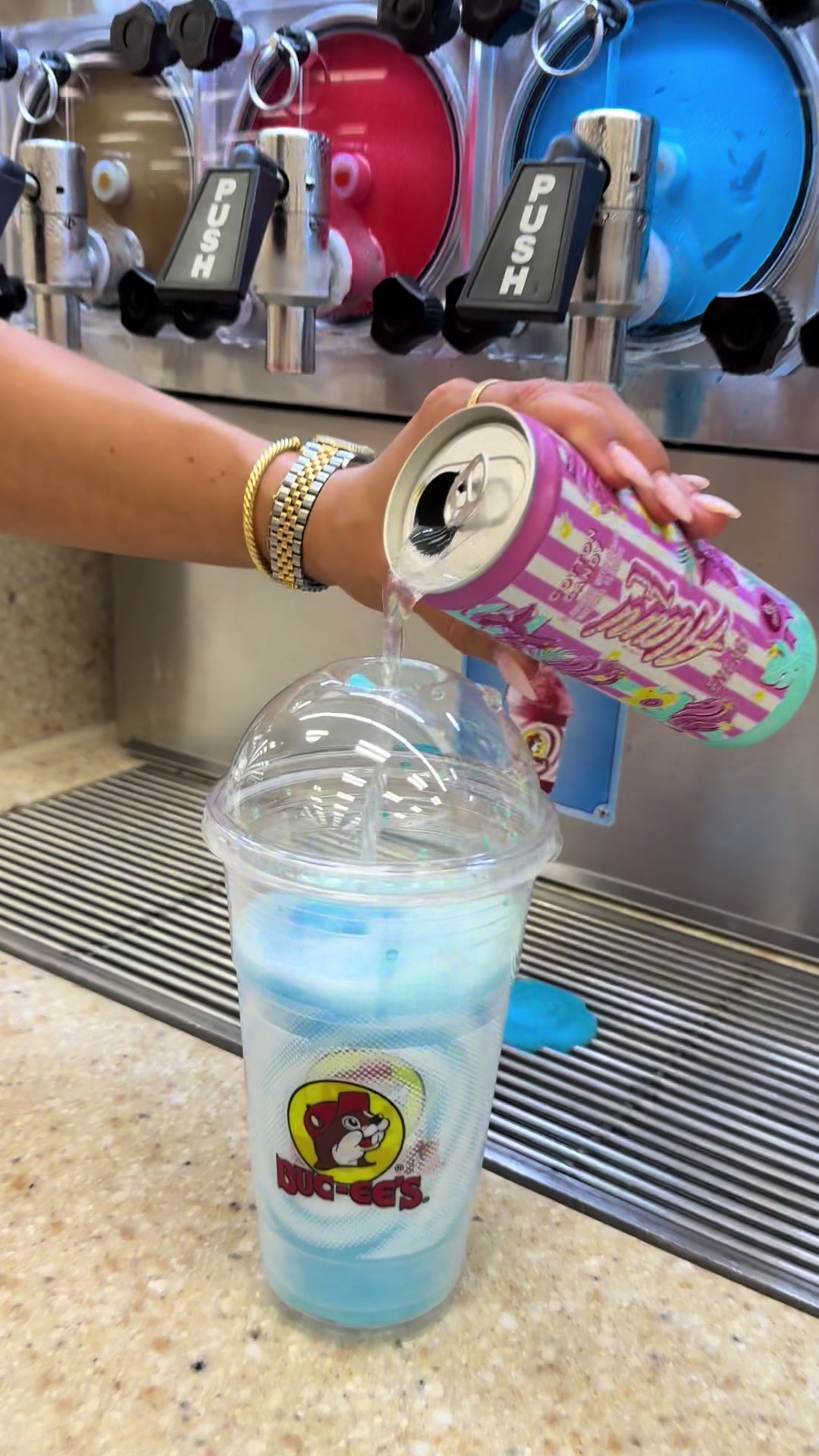 TikTok post by @laniekristin for Alani Nu. Caption reads: [...] candy alani icee at buc-ee’s🍬✨🩵 @Alani Nu....