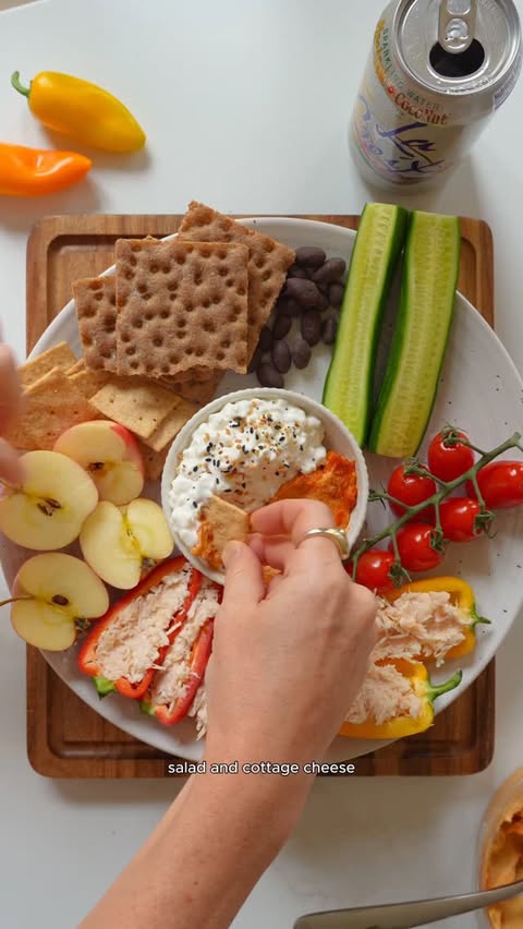 Instagram post by @nourishment.nutrition for LaCroix Sparkling Water. Caption reads: #ad Snack Plate lunch with @lacroixwater today....