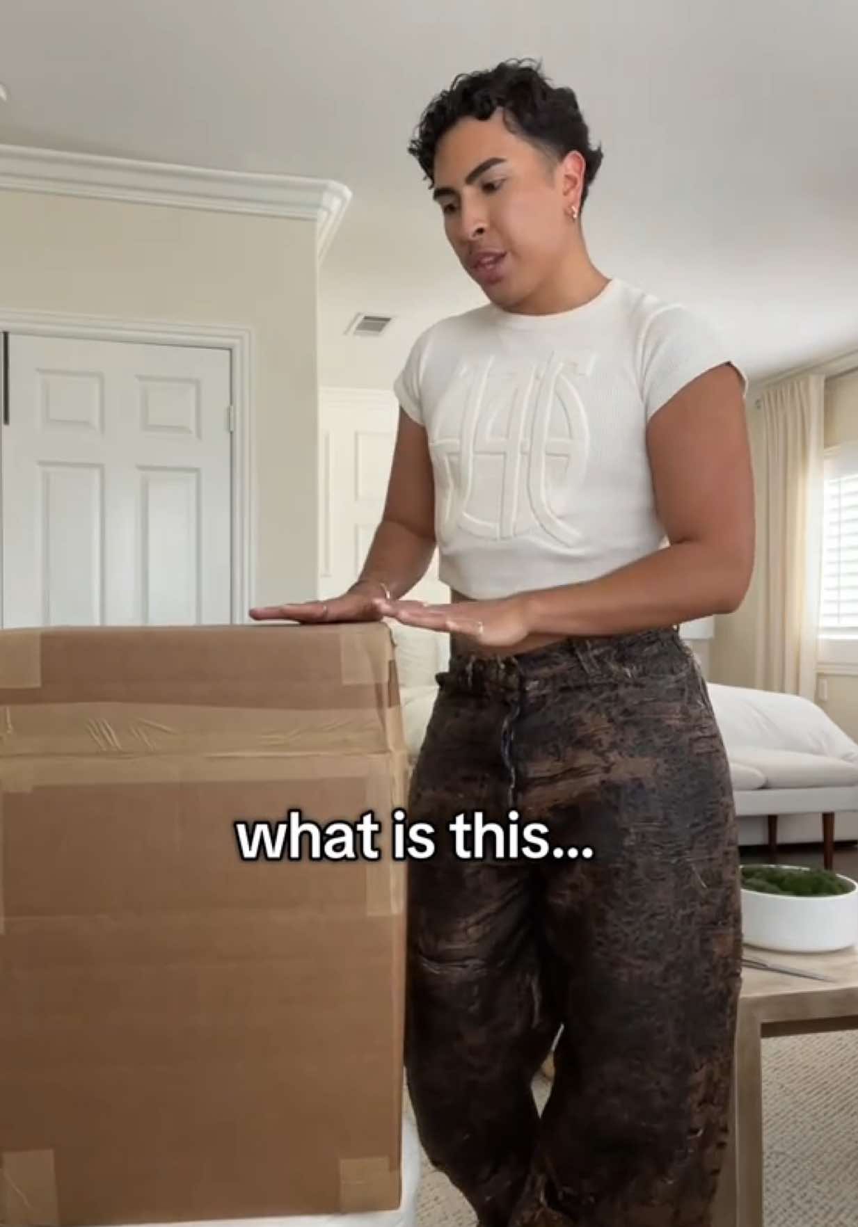 TikTok post by @louiecastro for Acne Studios. Caption reads: was NOT expecting this🥺 #birthday #unboxing....