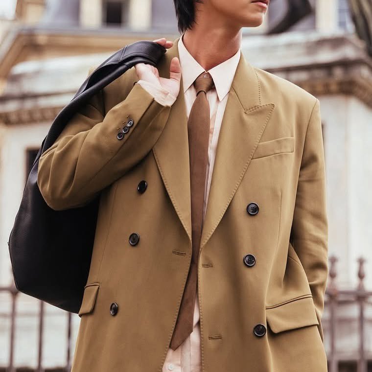 Instagram post by @tong_sutipat for AMI Paris. Caption reads: BRIGHT WITH AMI PARIS 🖤 @bbrightvc @amiparis....