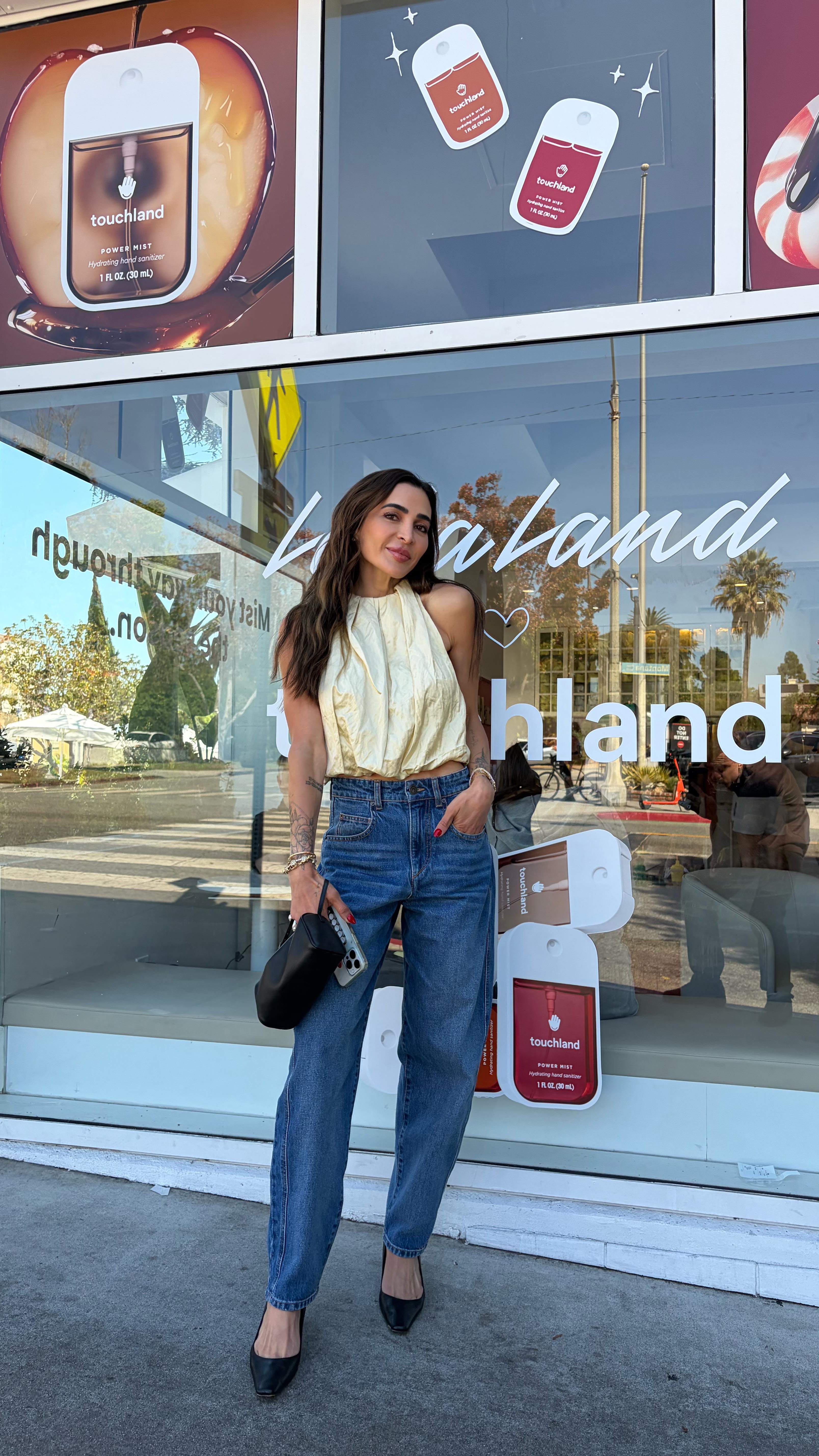 Instagram post by @kalejunkie for Touchland. Caption reads: Come with me to a fun pop up at @lalaland to....