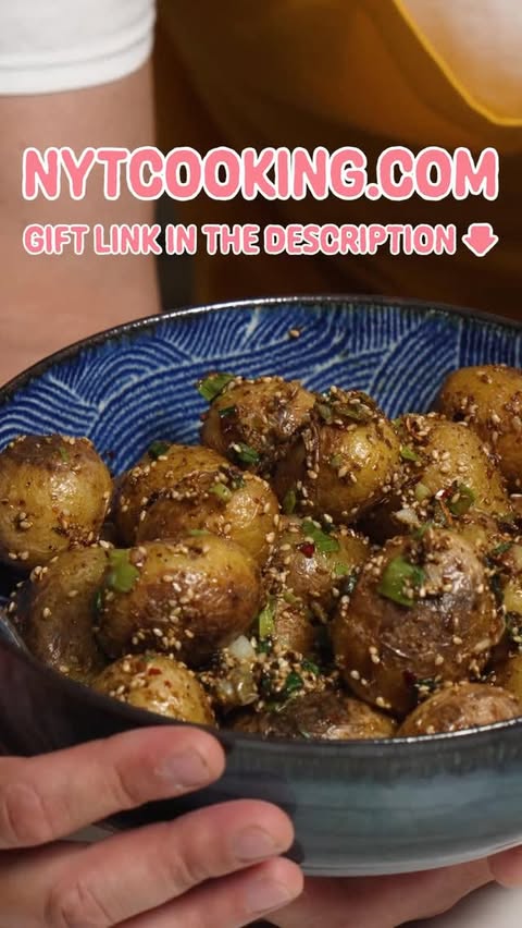 Instagram post by @kenjilopezalt for NYT Cooking. Caption reads: Hot and numbing stir-fried new potatoes are a dish....