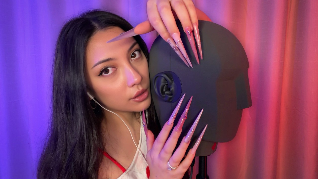 YouTube post by @ASMRJADE for The Oodie. Caption reads: ASMR tapping and scratching ON a $10,000....