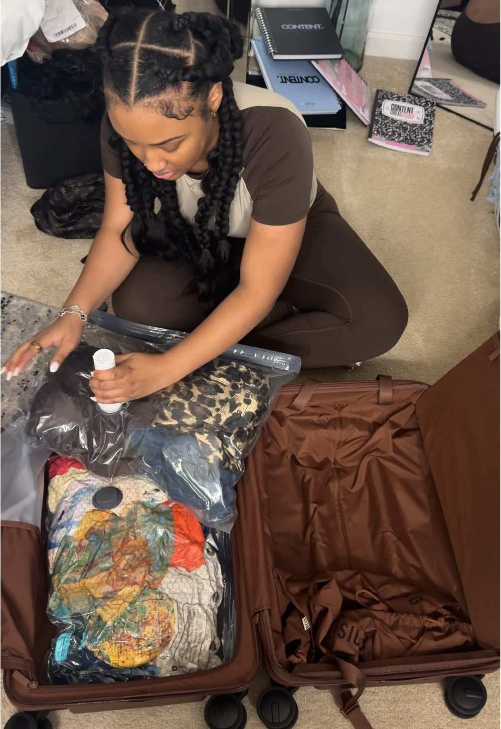 TikTok post by @thesariaraine for BÉIS Travel. Caption reads: A travel MUST HAVE! 😌 #vacuumseal #howtopack....