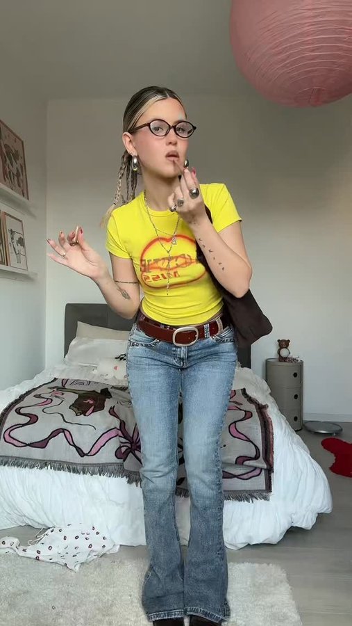 Instagram post by @borbonibenedetta for MISS SIXTY. Caption reads: [...] with this belt loop flared jeans?? 🤓....