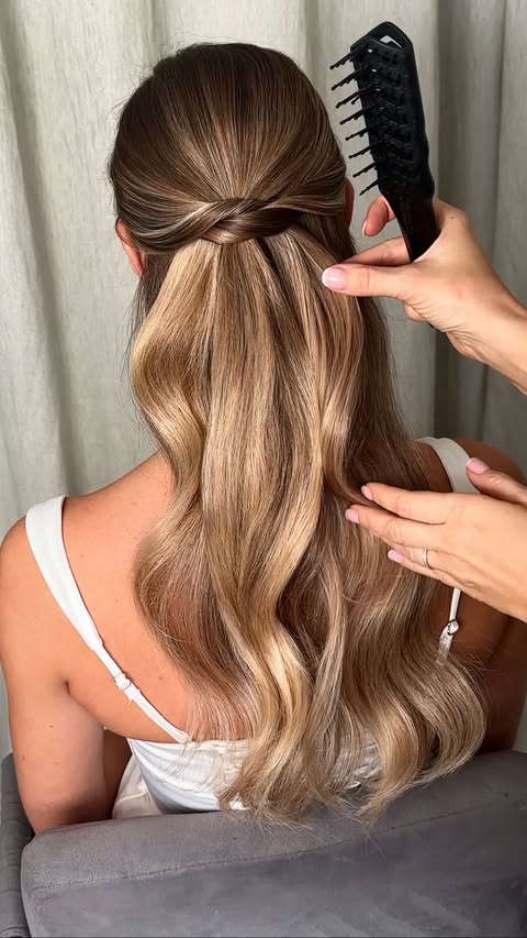 Instagram post by @kasia_fortuna for Moroccanoil Professionals. Caption reads: Simple half-up, half-down styles are clearly here....