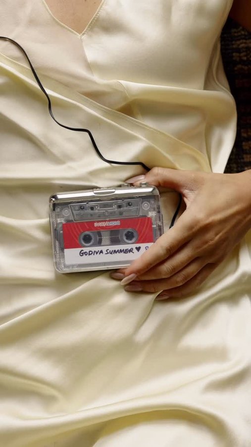 Instagram post by @theserenagoh for Godiva. Caption reads: Summer is like a box of chocolates — each day....