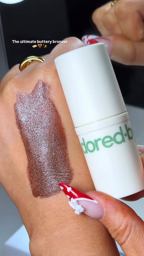 Instagram post by @itsheatherbell for Adored By. Caption reads: No notes, just perfection 🧈🤎🤤 from @adoredbyuk....