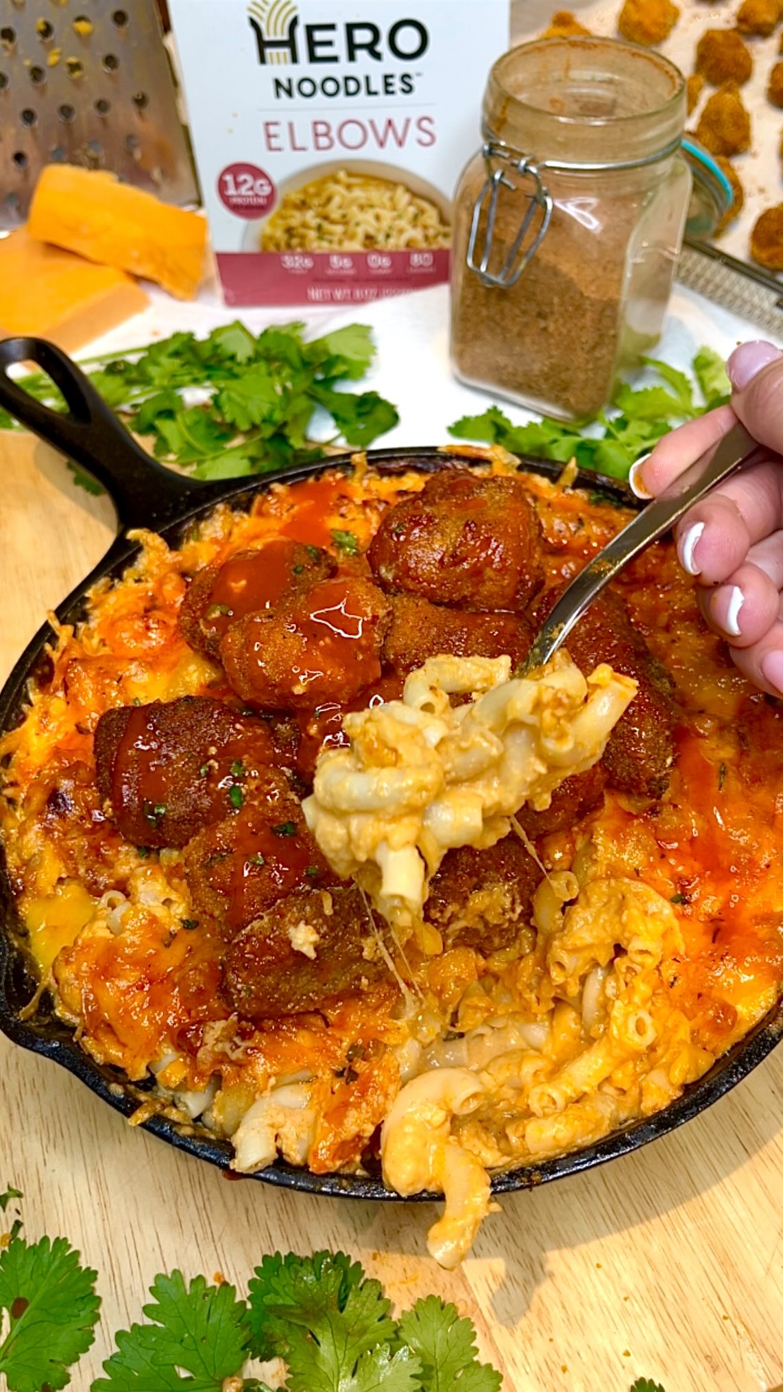 Instagram post by @fitfoodiestasia for Hero Bread. Caption reads: 🧀🔥CRISPY BAKED MAC & HONEY BUFFALO NUGGETS ↓

✅....