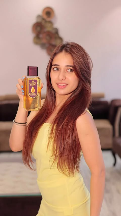 Instagram post by @kanika868 for Bajaj Almond Drops. Caption reads: [...] the difference! 💚 A few drops of Bajaj....