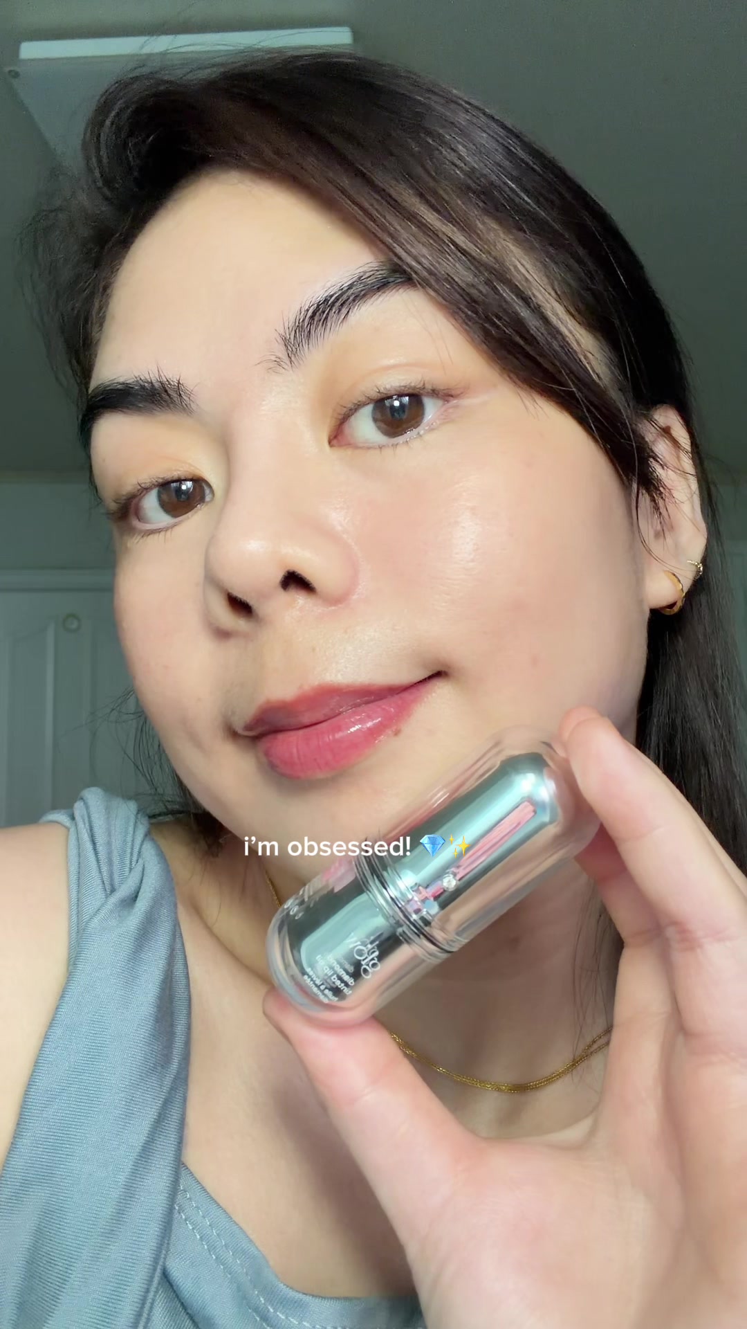 TikTok post by @yeonjinaahh for Glow Is Here. Caption reads: Glass-like shine with the care of a lip treatment.....