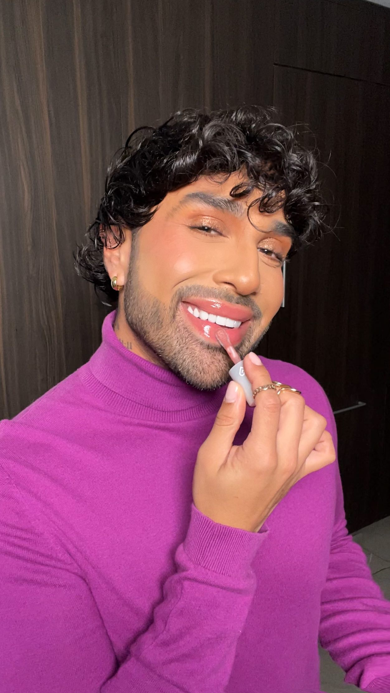 Instagram post by @mac_daddyy for Kaja Beauty. Caption reads: Holiday glam has entered the chat! 📲🎁💕

The....