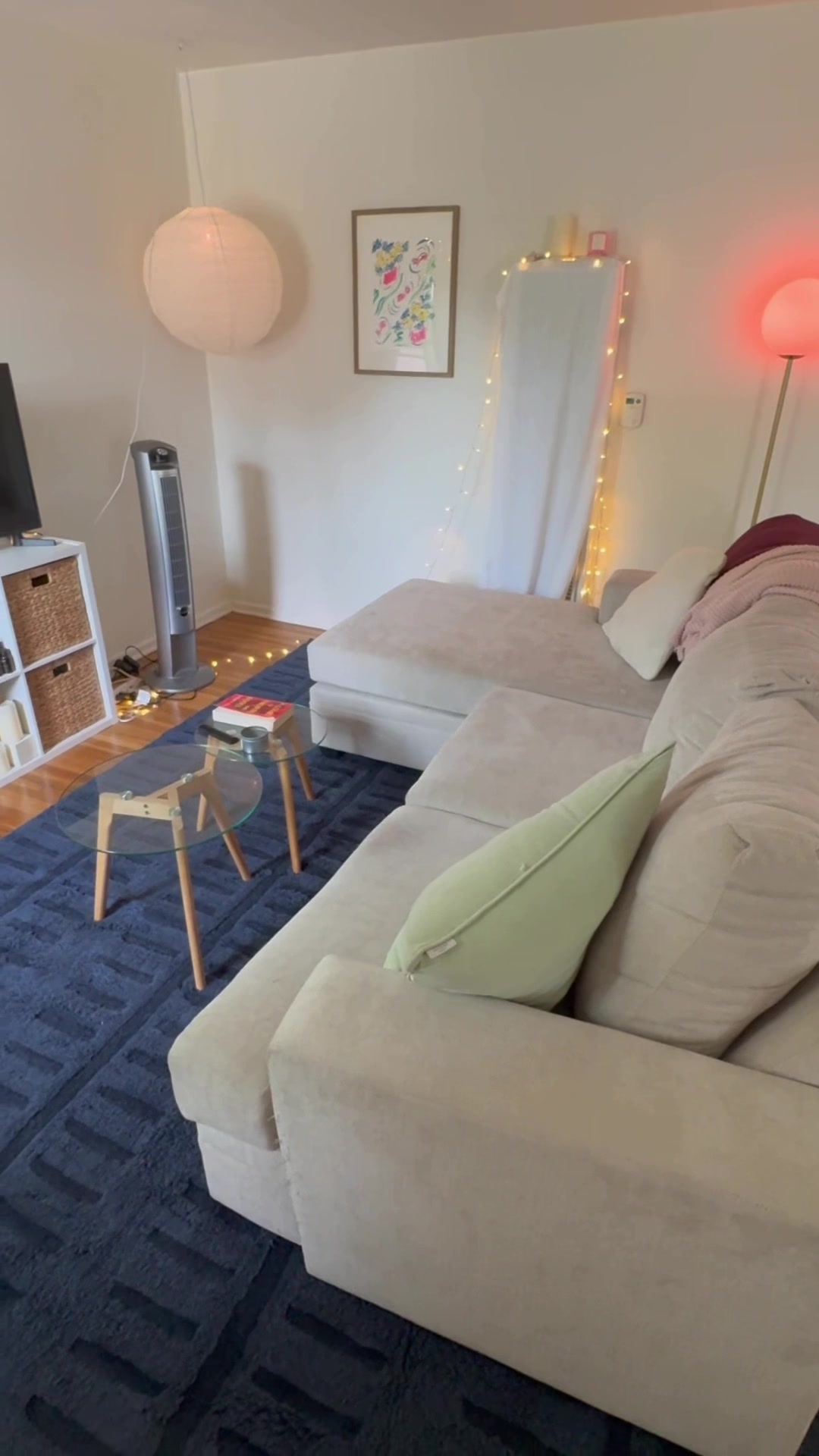 TikTok post by @xokatieasmr for Revival Rugs. Caption reads: [...] living room cozier w/ some help from....