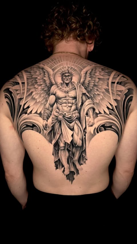 Instagram post by @skinandinkmag for Pepax Official. Caption reads: Archangel full back tattoo in black and grey....