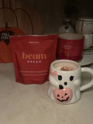 TikTok post by @xo.becksss for Beam. Caption reads: [...] without drinking my pumpkin hot cocoa 🎃....