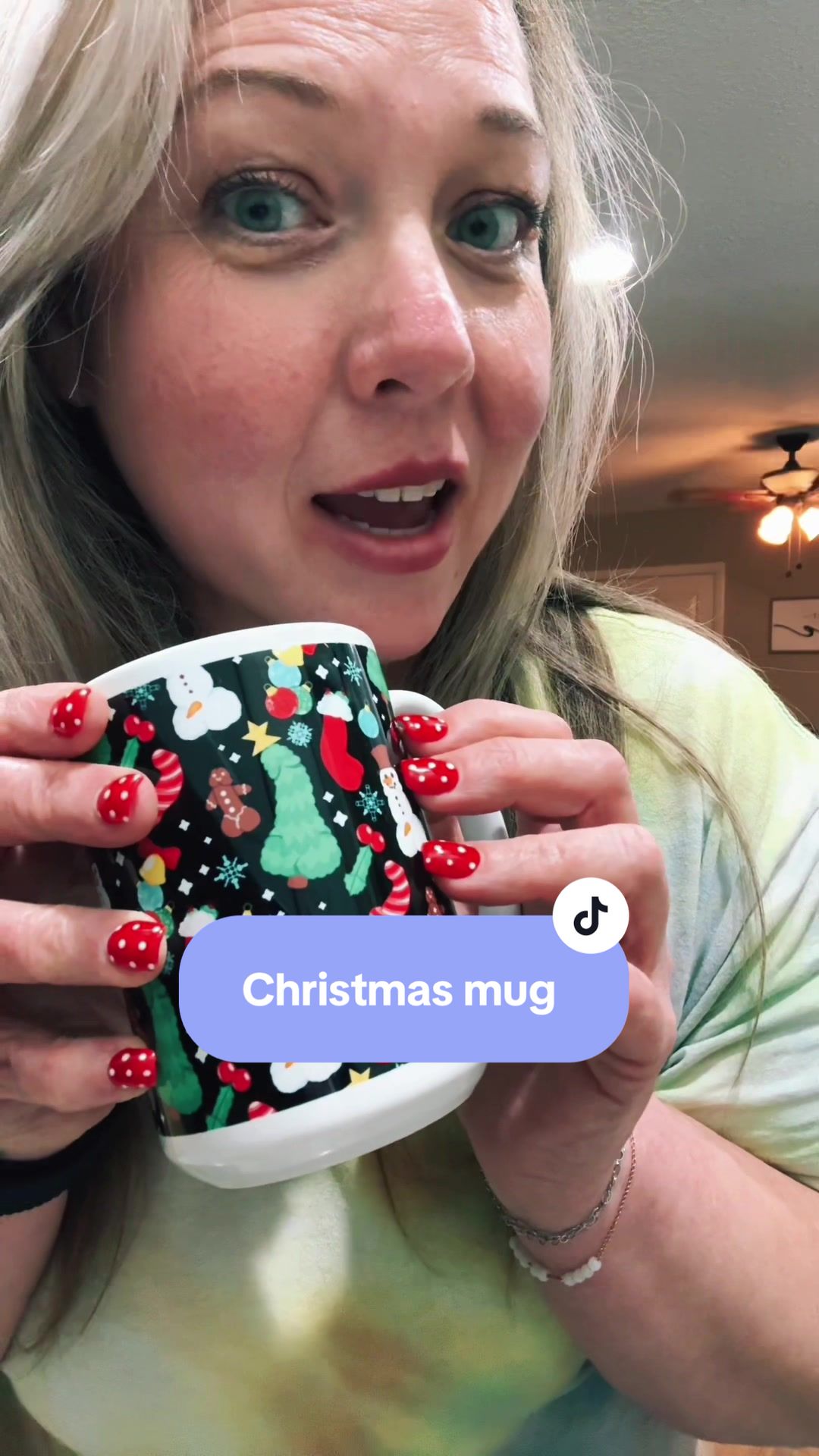 TikTok post by @shoppinwithamy for LookHUMAN. Caption reads: [...] and watch the chaos unfold. 🎄☕😂 @LookHUMAN....