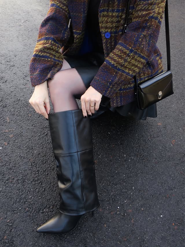 Instagram post by @mel.zzie for JustFab. Caption reads: Boot game strong 👢🖤😆
.
@justfabonline 
Get your....