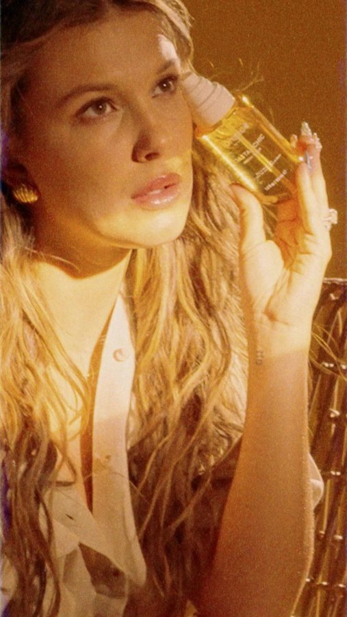 Instagram post by @milliebobbybrown for florence by mills. Caption reads: instantly transport to your next destination in....