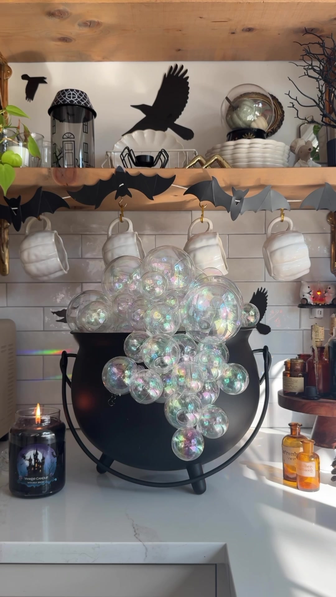TikTok post by @thekwendyhome for Yankee Candle. Caption reads: Let’s make a Witches’ Brew craft inspired by....