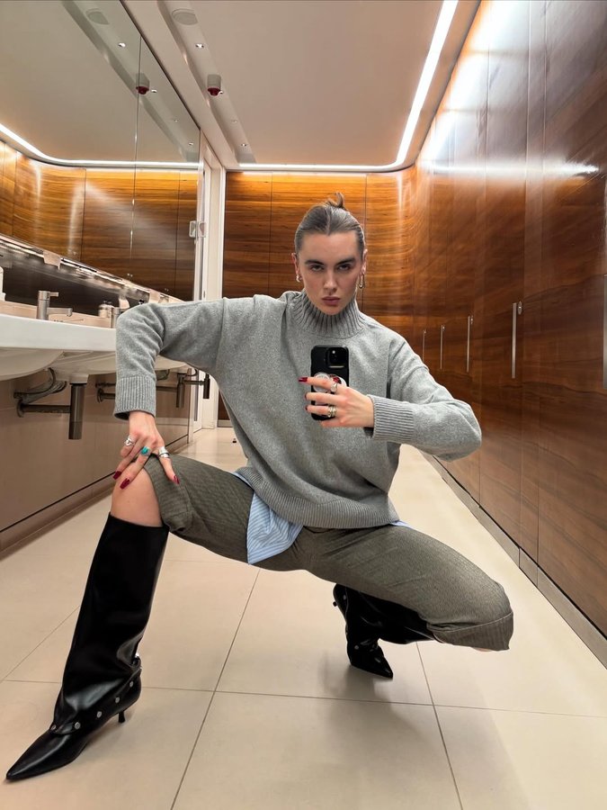 Instagram post by @katfromfinance for ARMEDANGELS. Caption reads: Me 🤝 a high-necked knit @armedangels #ad.