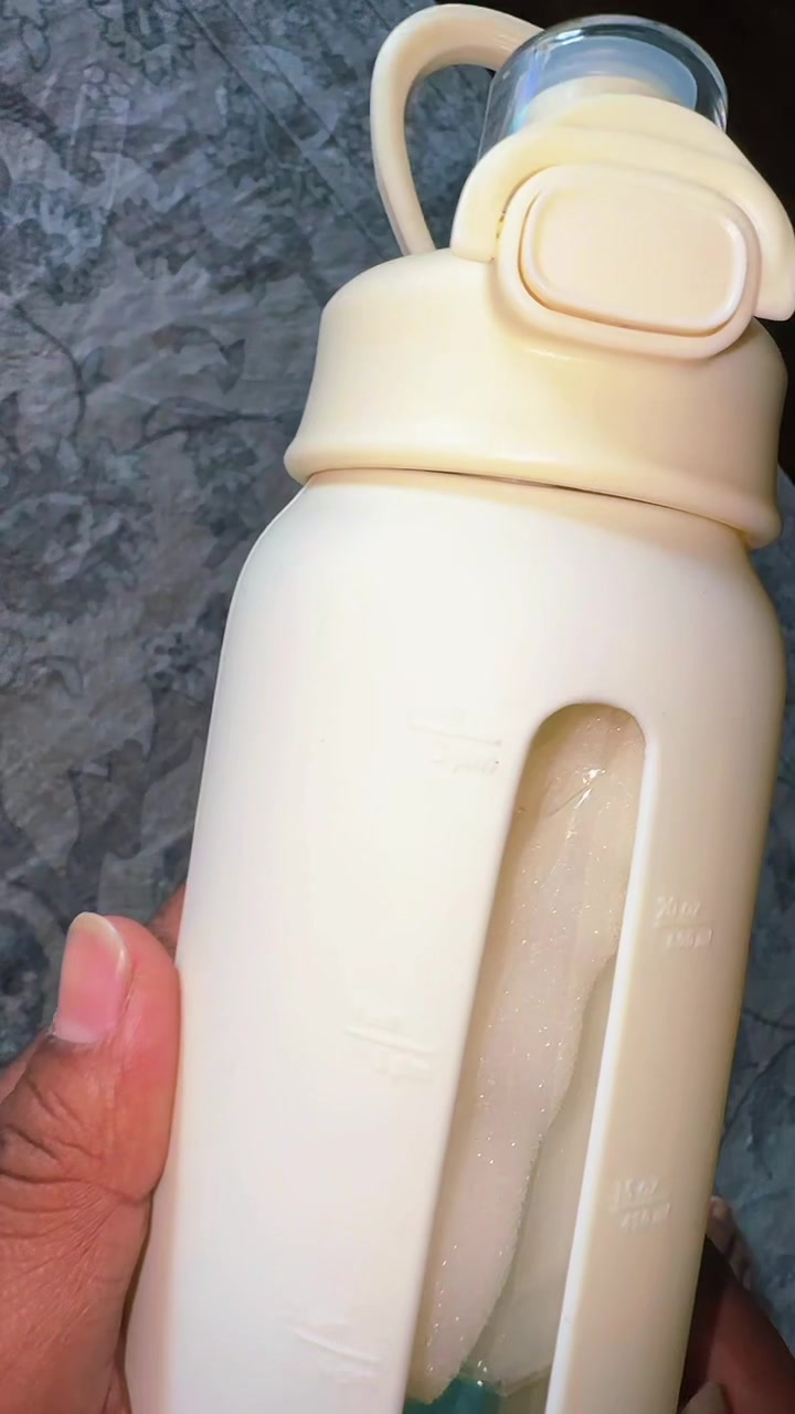 TikTok post by @maamtaa for Sandjest. Caption reads: 24oz reusable glass bottle @SANDJEST #SANDJEST....