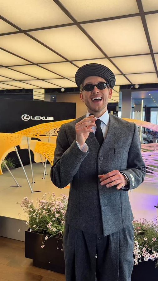 Instagram post by @elliotgarnaut for Lexus. Caption reads: The fashion crowd was serving racing fashion at....
