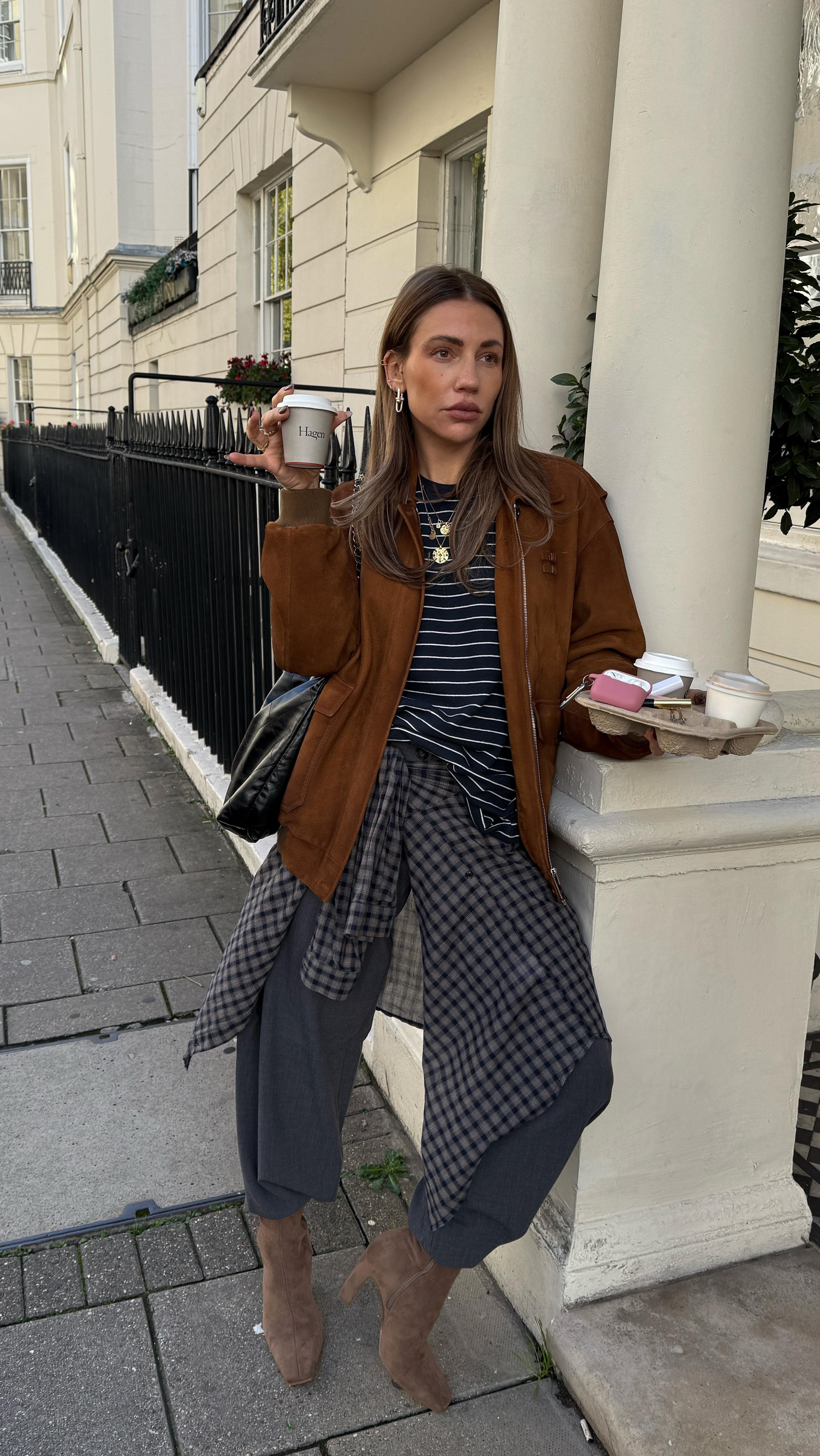 Instagram post by @whatgigiwears for Steve Madden. Caption reads: Coffee runs are just an excuse to wear my new....