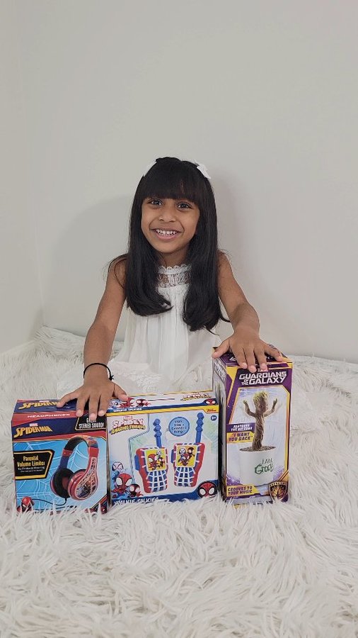 Instagram post by @akira_littleprincess for eKids. Caption reads: Unboxing our Marvel goodies from @ekidstoys just....