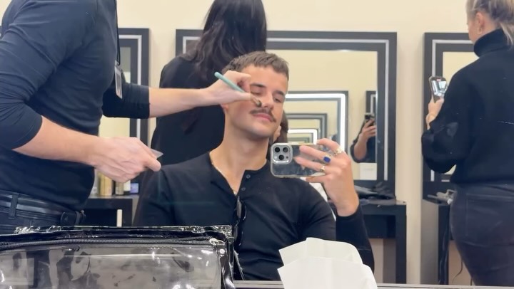 Instagram post by @scheddybratzke for Armani Exchange. Caption reads: [...] vlog: 24hrs in the city to shoot....