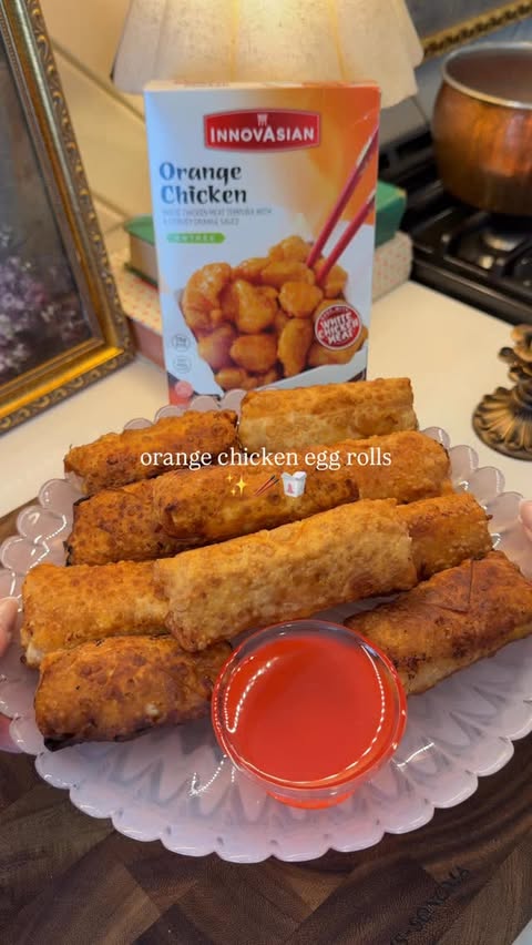 Instagram post by @kdamitz for InnovAsian Cuisine. Caption reads: I didn’t think orange chicken needed improving …....